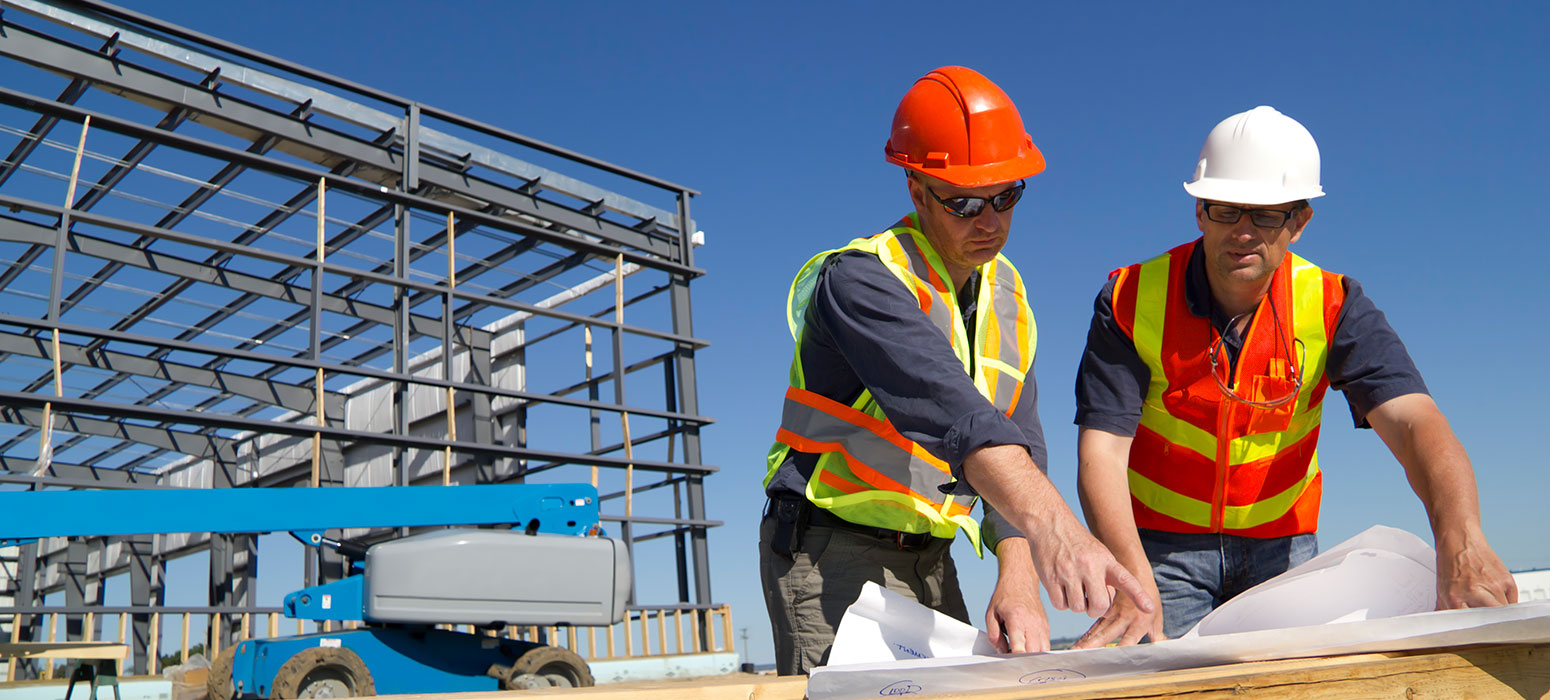 CultIron_Careers 2 workers checking drawings by metal framework